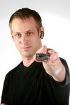 Man with wireless gizmo
clamped to his ear